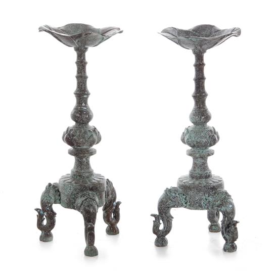 Appraisal: Pair Asian bronze candleholders scalloped bowl turned column trefoil base