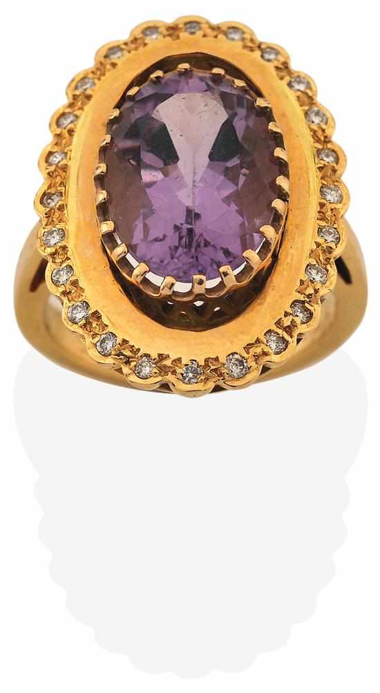 Appraisal: AN AMETHYST AND DIAMOND RING Centrally set with an oval