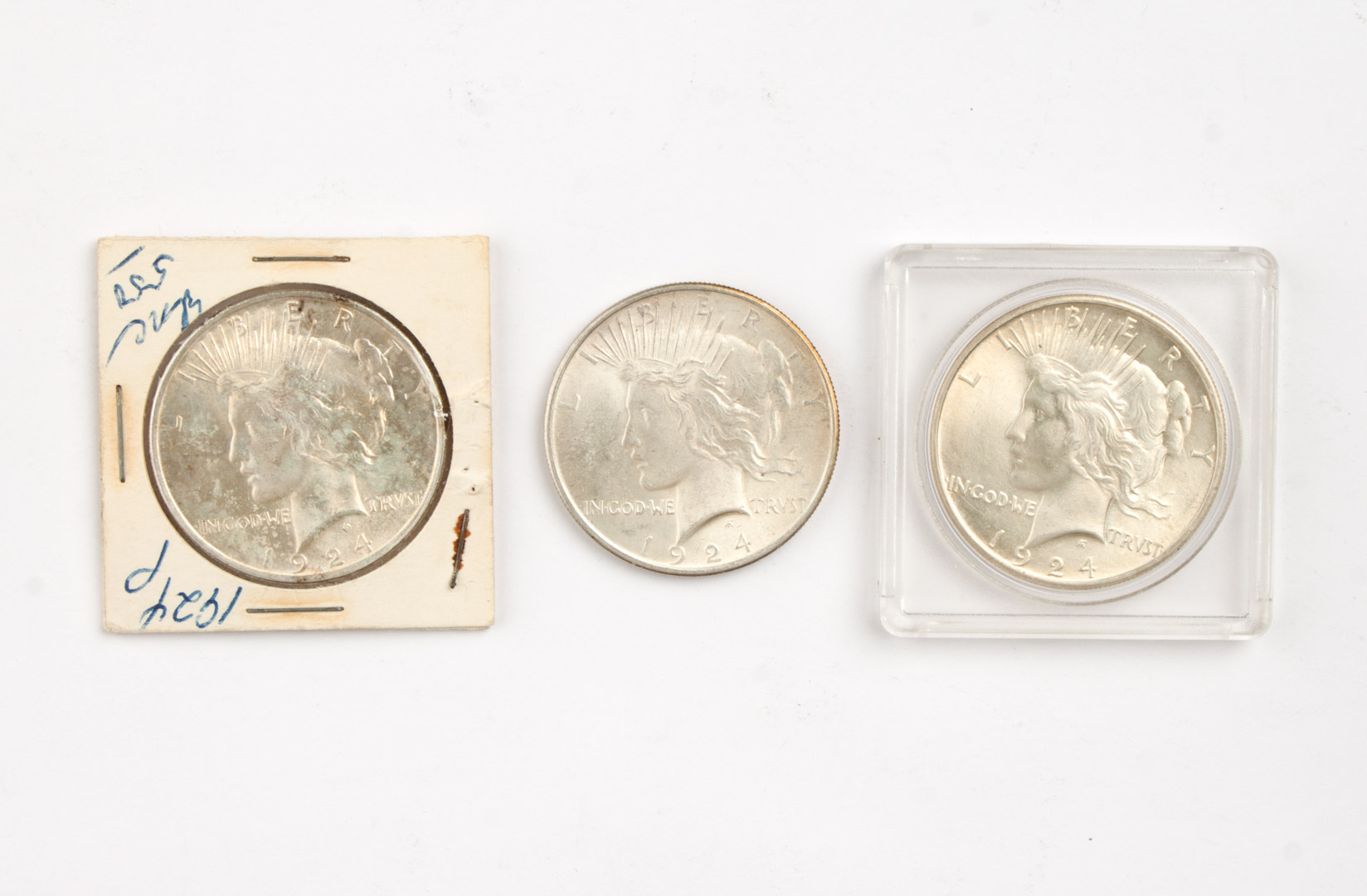 Appraisal: Three U S Peace type silver dollars MS- MS- with