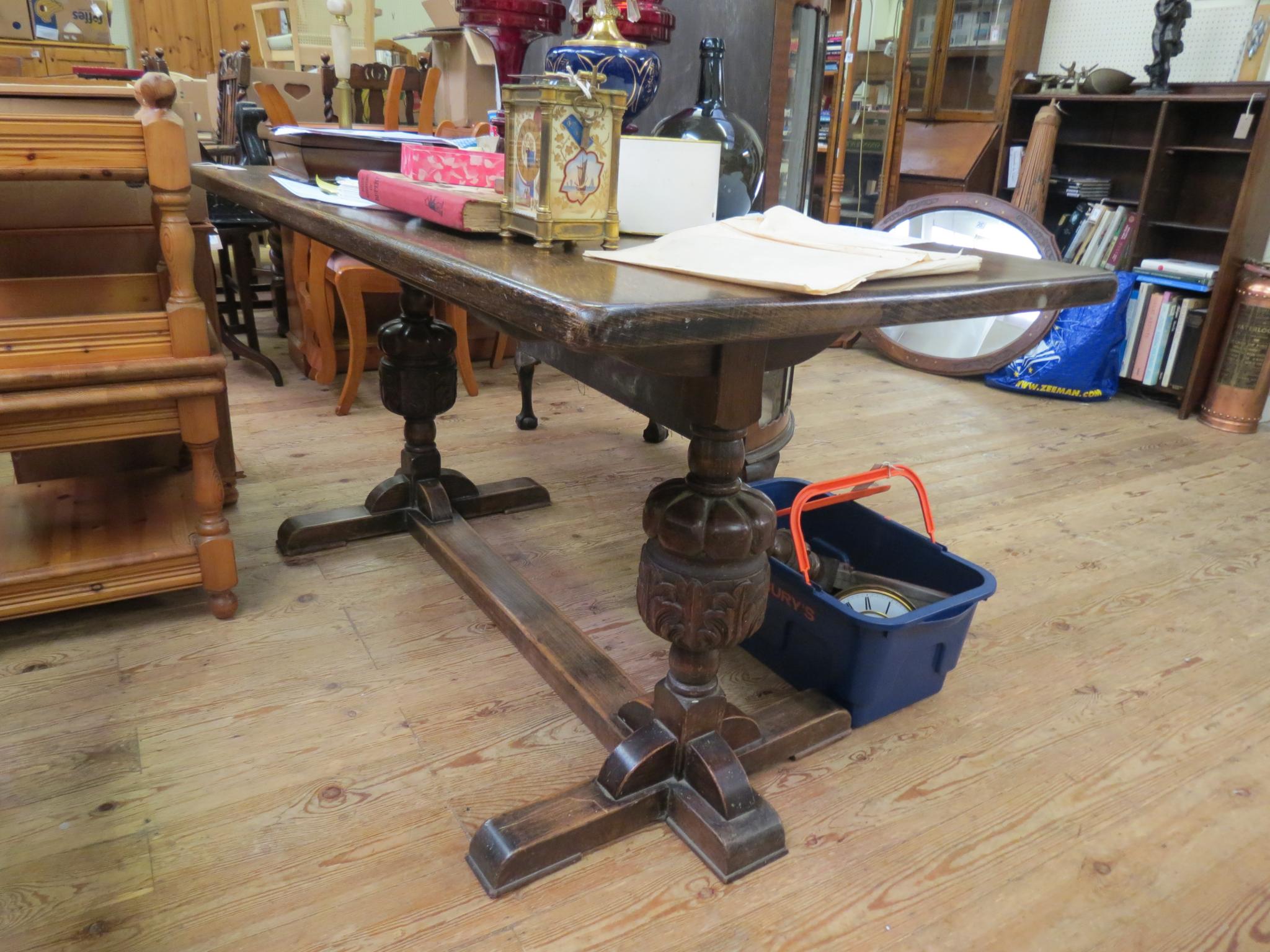 Appraisal: A solid dark oak refectory-type dining table on bulbous carved