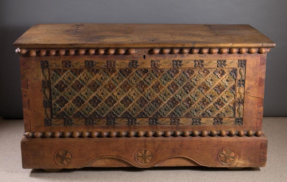 Appraisal: A LARGE CARVED MERANTI WOOD DOWRY CHEST Indonesian th century