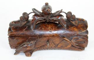 Appraisal: Black Forest yule log form dresser box Black Forest yule