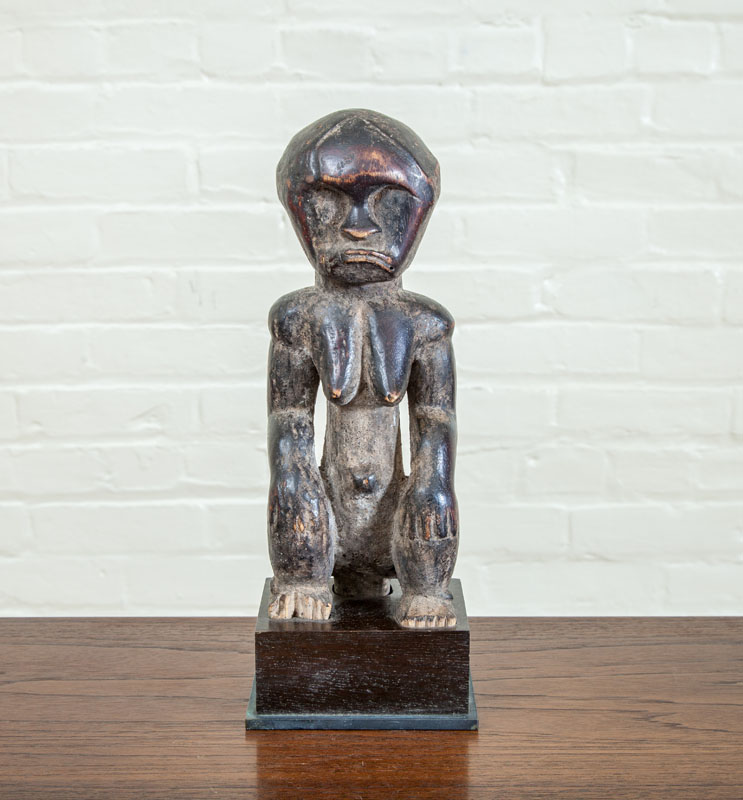 Appraisal: FANG CARVED WOOD FEMALE FIGURE Seated on wooden base x