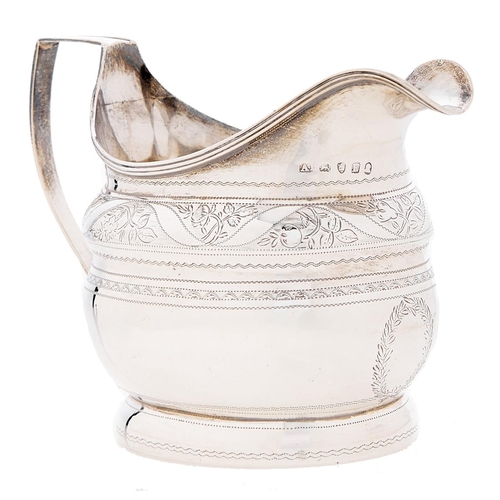 Appraisal: A George III engraved silver cream jug reeded handle and