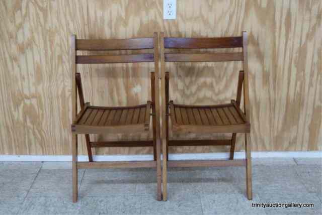 Appraisal: Vintage Slat Wood Folding ChairsFrom the estate is a pair