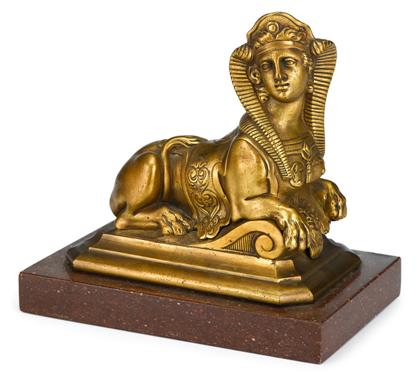 Appraisal: French gilt metal model of a SphinxTypical form The female