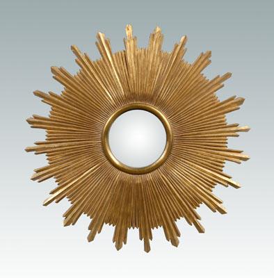 Appraisal: Carved and gilt wood sunburst mirror central round mirror and