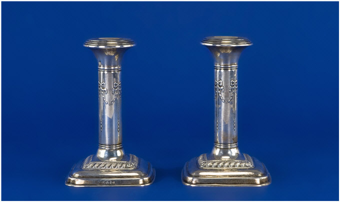 Appraisal: Pair of Silver Candlesticks Plain columns with swag and bow