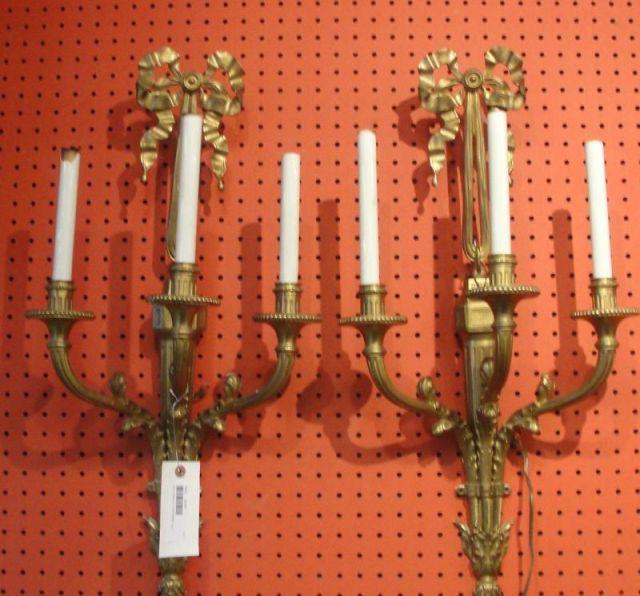 Appraisal: Pair of Bronze Arm Ribbon Top Sconces From a Queens