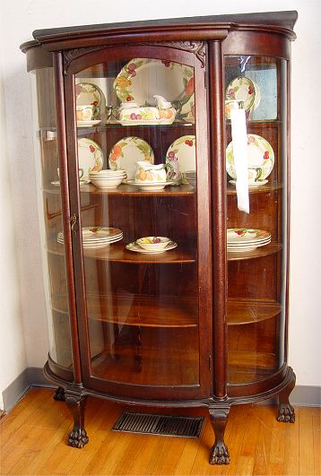 Appraisal: TRIPLE BOW TIGER OAK CHINA CABINET Late th to early