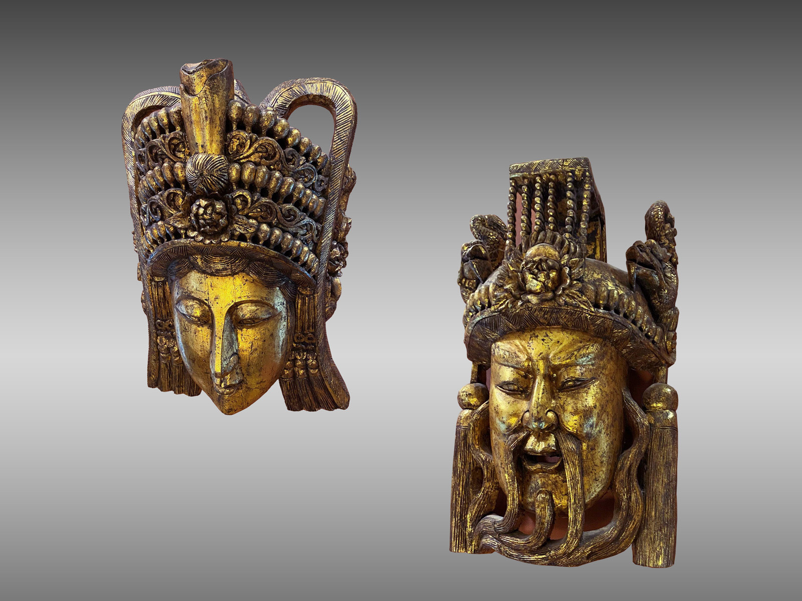 Appraisal: LARGE CARVED GILT CHINESE EMPEROR EMPRESS MASKS Carved wooden Chinese