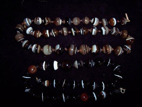 Appraisal: Two necklets of agate beads with circular striped stone beads