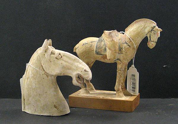 Appraisal: Two pottery fragments One a Tang style horse head the