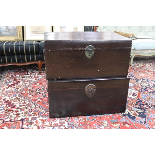 Appraisal: Two similar Chinese black lacquered trunks drop bale carry handles