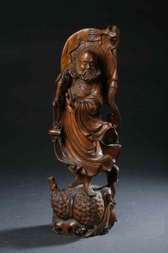 Appraisal: CHINESE BOXWOOD FIGURE OF IMMORTAL Qing dynasty Standing on double