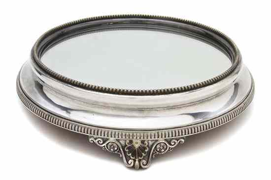 Appraisal: A Silverplate Table Plateau the circular mirrored top having beaded