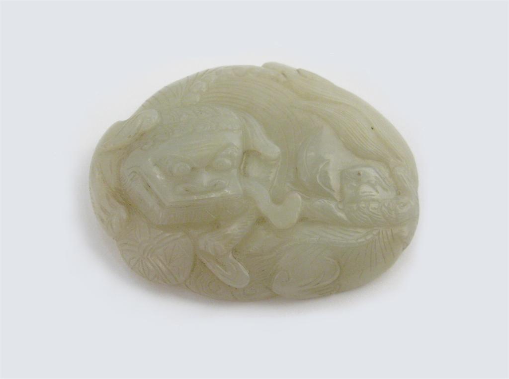 Appraisal: A Chinese pale celadon jade belt buckle