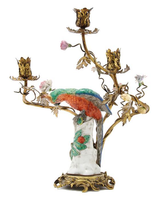 Appraisal: A Continental Porcelain Parrot mounted on a three-light candelabrum base