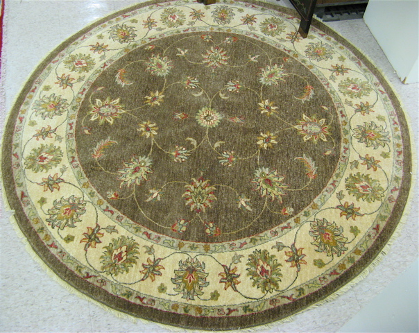 Appraisal: ROUND ORIENTAL ACCENT RUG Pakistani Persian floral vines decorations on