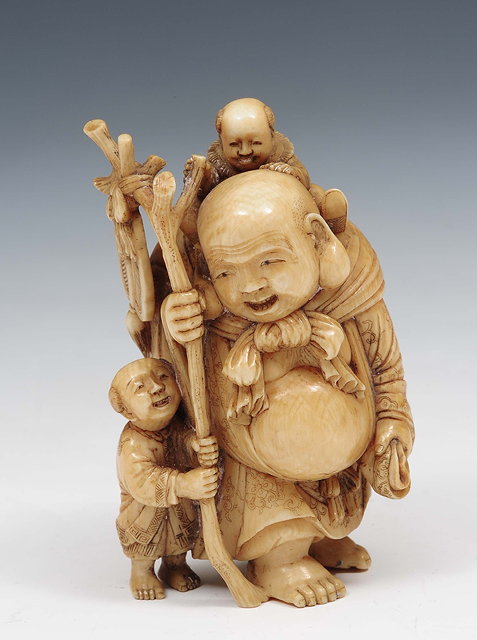 Appraisal: A Japanese stained ivory okimonoMeiji periodin the form of Hotei