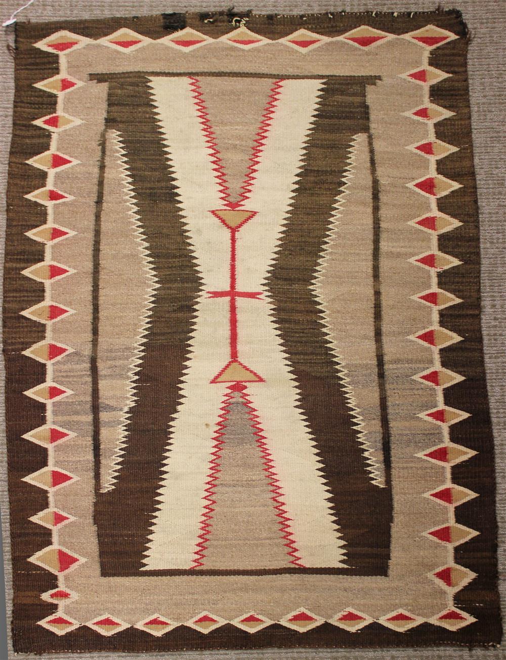 Appraisal: NAVAJO WEAVING natural and analine dyed homespun wool serrated hourglass