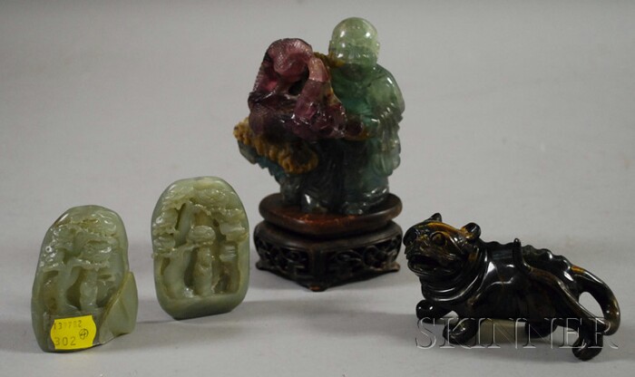 Appraisal: Four Hardstone Carvings China two celadon jade pebbles each carved