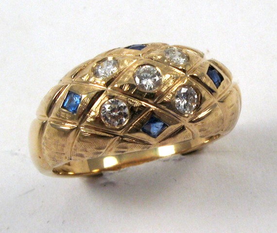 Appraisal: SAPPHIRE AND FOURTEEN KARAT GOLD RING set with four facet-cut