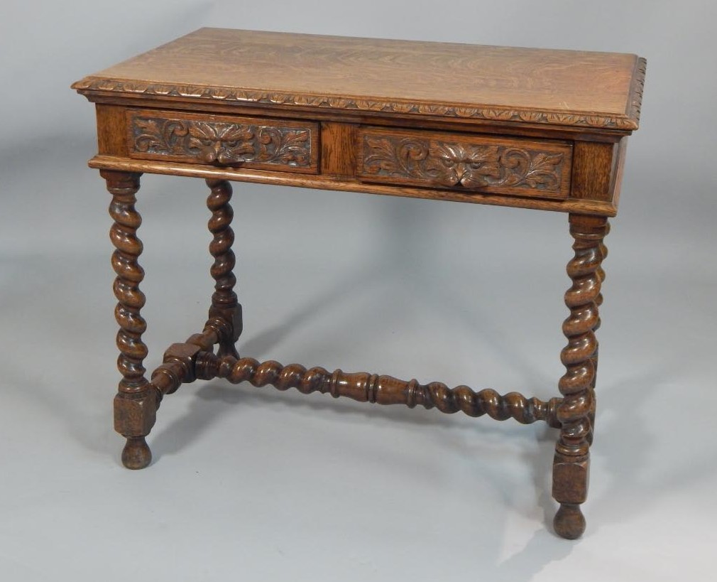 Appraisal: A Victorian oak side table with a carved border above