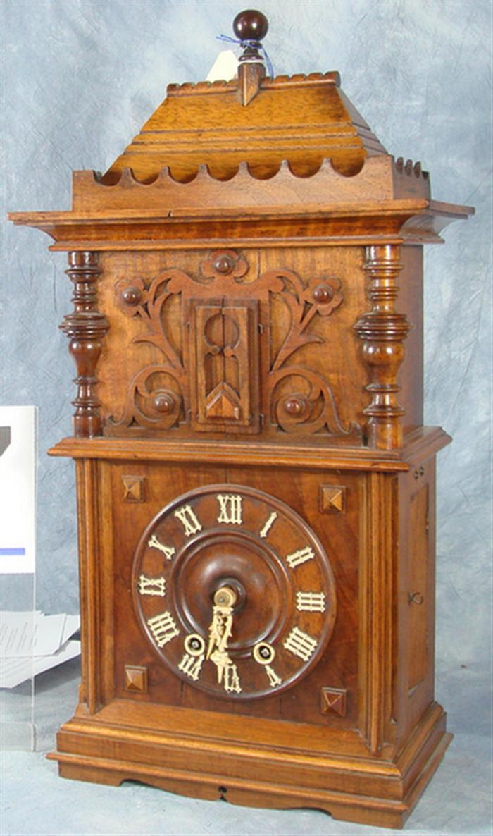 Appraisal: Carved walnut German bugler mantle clock hr hr strike working