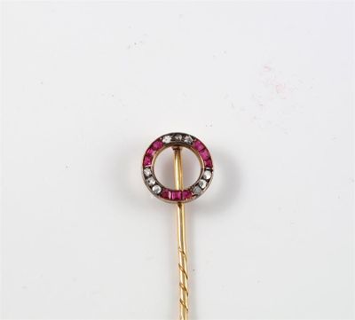 Appraisal: A ruby and diamond set 'finishing post' gold stick pin