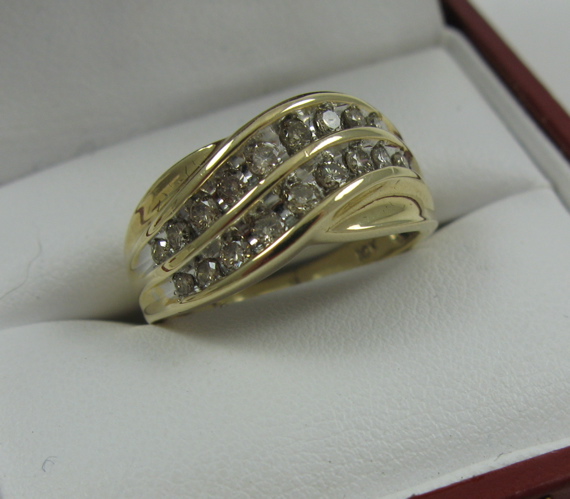 Appraisal: DIAMOND AND FOURTEEN KARAT GOLD RING the round-cut diamonds having