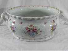 Appraisal: A large two handled oval ironstone cistern with floral decoration