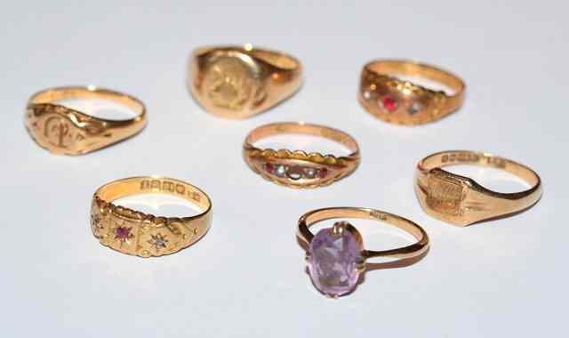 Appraisal: TWO CT GOLD SIGNET RINGS a three stone ruby and