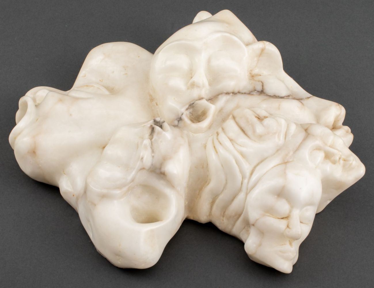 Appraisal: NORMAN CARTON 'GROTESQUE FACES' MARBLE SCULPTURE Norman Carton Ukrainian American