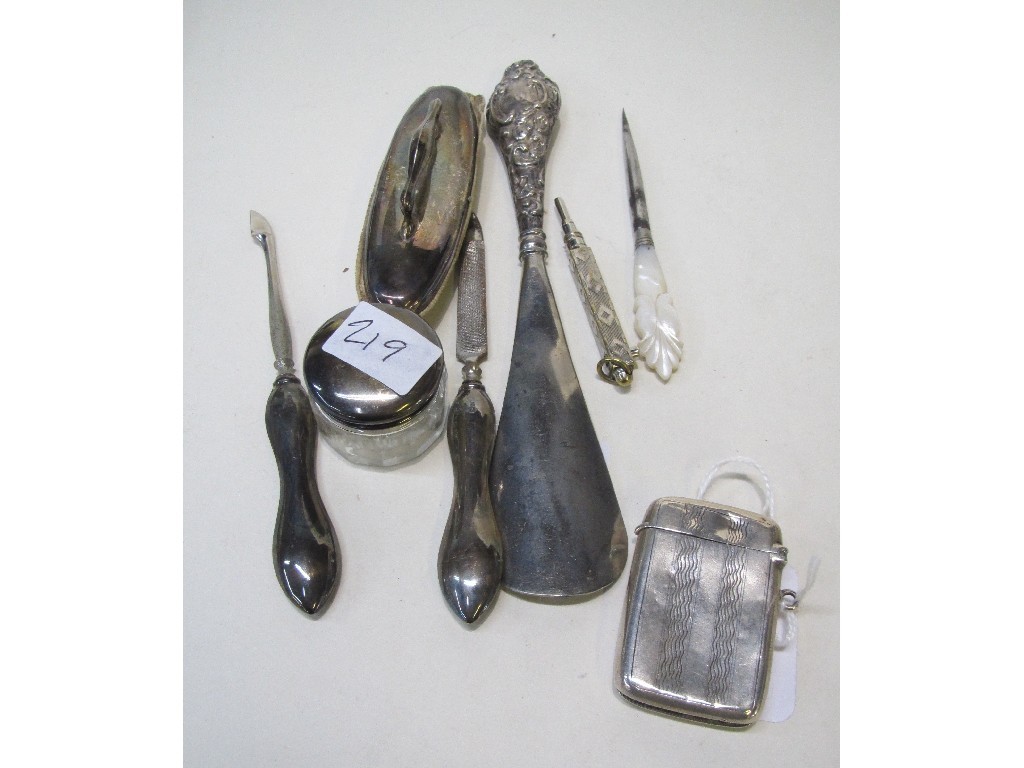 Appraisal: Lot comprising silver vesta part manicure set and a shoehorn