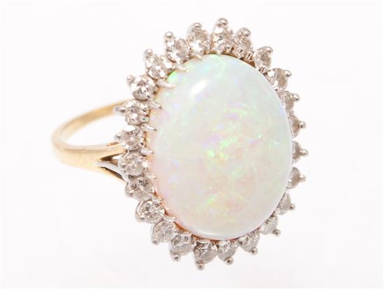 Appraisal: Lady's K yellow gold diamond and opal ring size