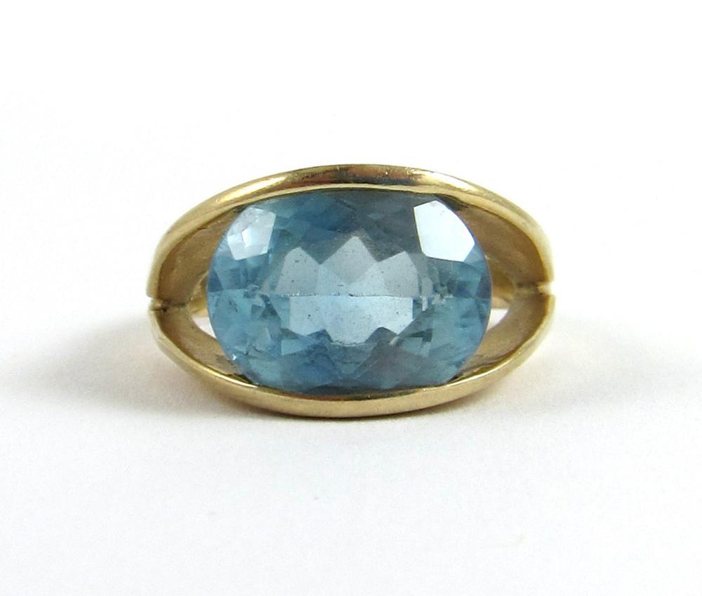 Appraisal: BLUE TOPAZ AND FOURTEEN KARAT GOLD SOLITAIRE RING featuring a