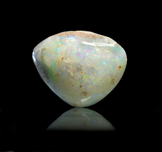 Appraisal: AN OPALIZED CLAM Coober Pedy Australia This specimen formed when