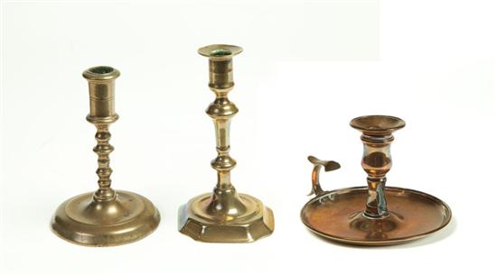 Appraisal: TWO BRASS CANDLESTICKS England mid th century Seamed construction Round