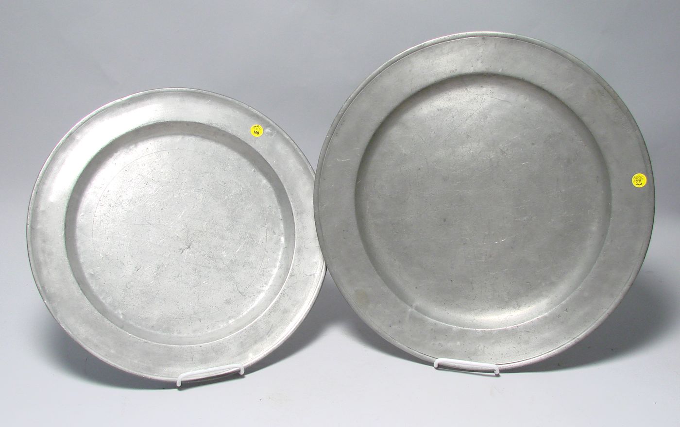 Appraisal: TWO ANTIQUE ENGLISH PEWTER CHARGERS Diameters and