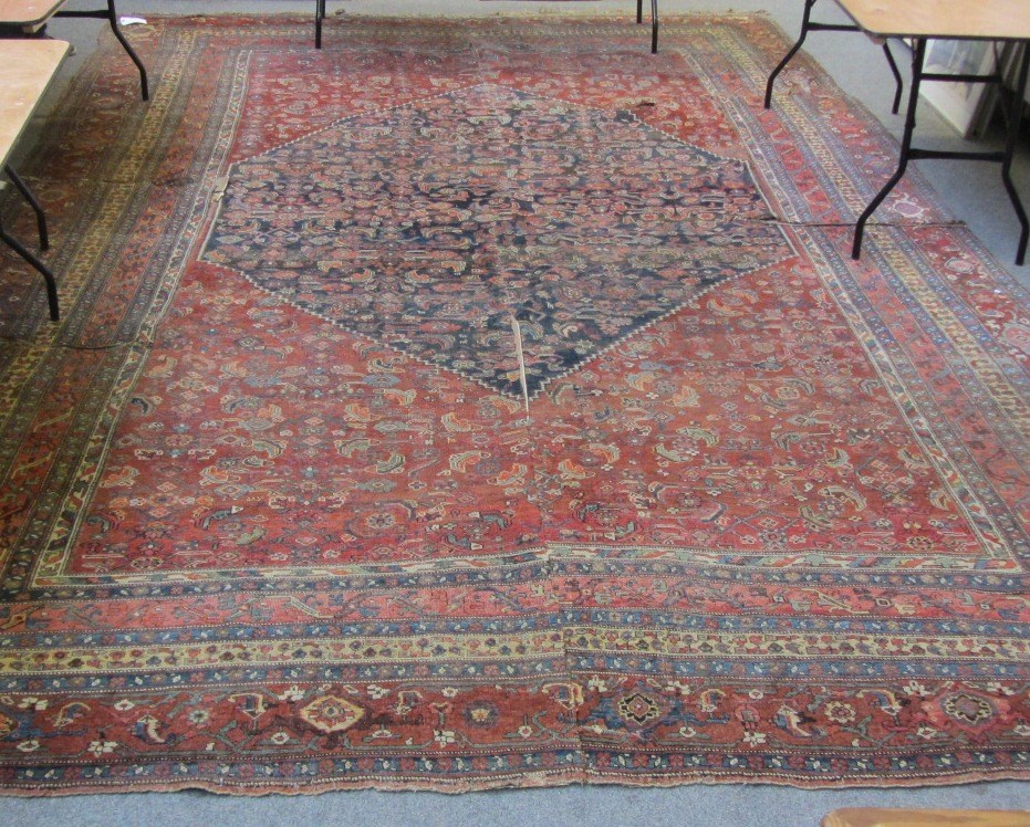 Appraisal: A Fereghan carpet Persian cut the madder field with a