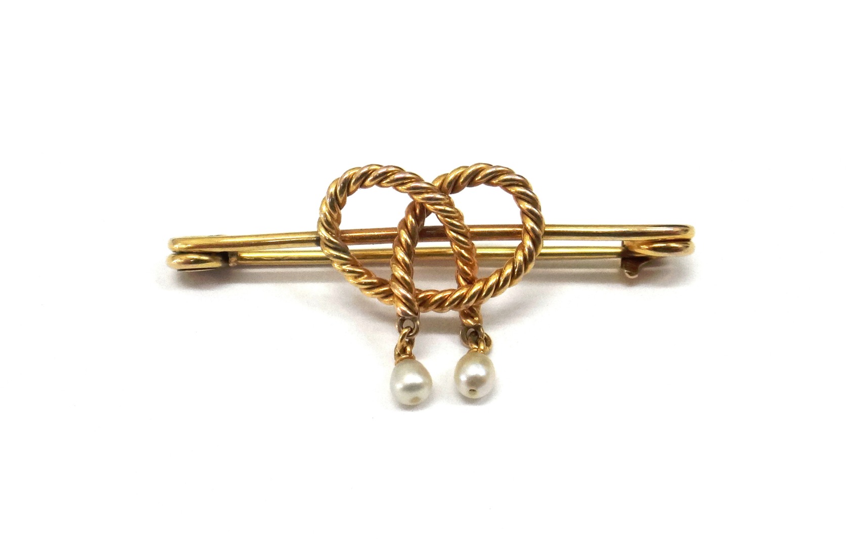 Appraisal: A late th century gold 'lovers knot' brooch with two