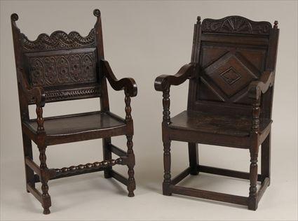 Appraisal: Two th Century-Style Carved Oak Wainscot Chairs to x to