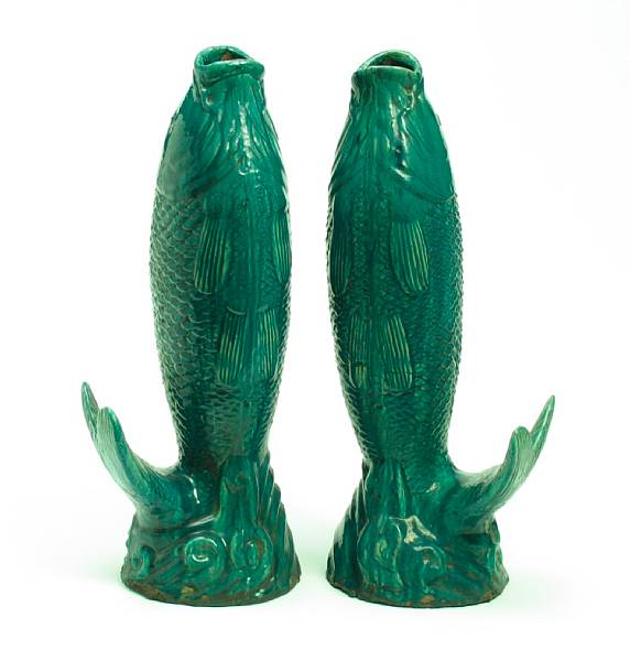 Appraisal: A pair of large Chinese fish form green glazed urns