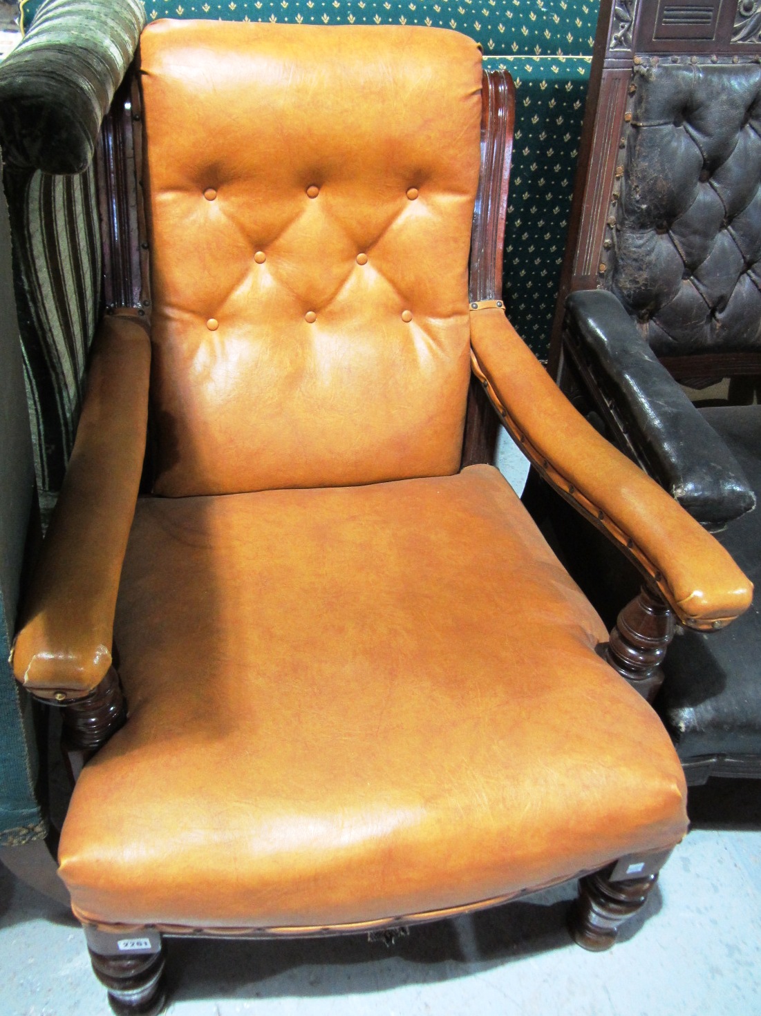 Appraisal: A th century mahogany framed open armchair on turned front