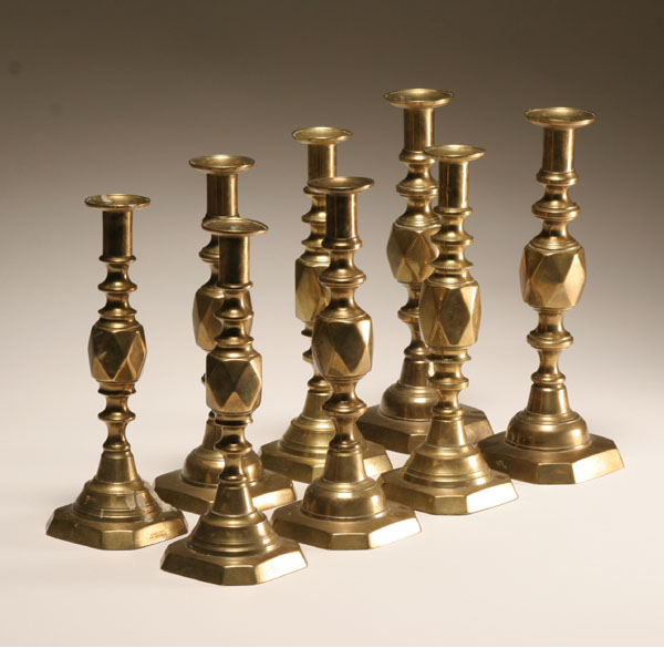 Appraisal: Set of English brass Diamonds graduated candlesticks including the King