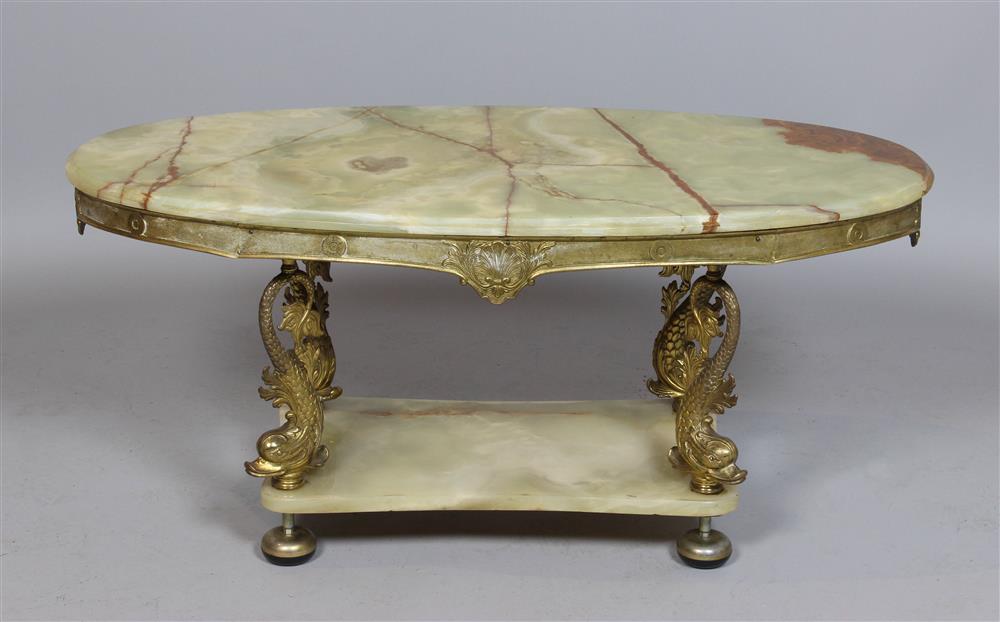 Appraisal: POLISHED ONYX AND BRASS OVAL SHAPED COFFEE TABLE the lozenge