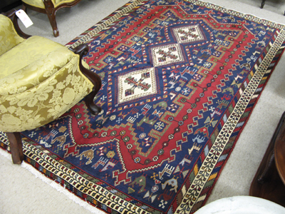 Appraisal: PERSIAN SIRJAN AREA RUG centering a column of three diamond-shaped