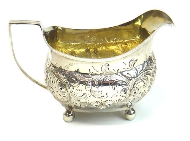 Appraisal: A George III silver milk jug of helmet shaped form