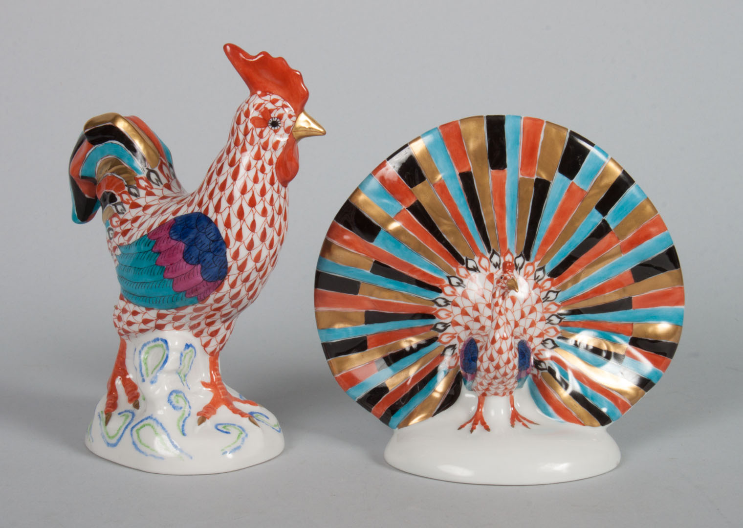 Appraisal: Herend porcelain rooster and peacock in the Rust Fishnet pattern